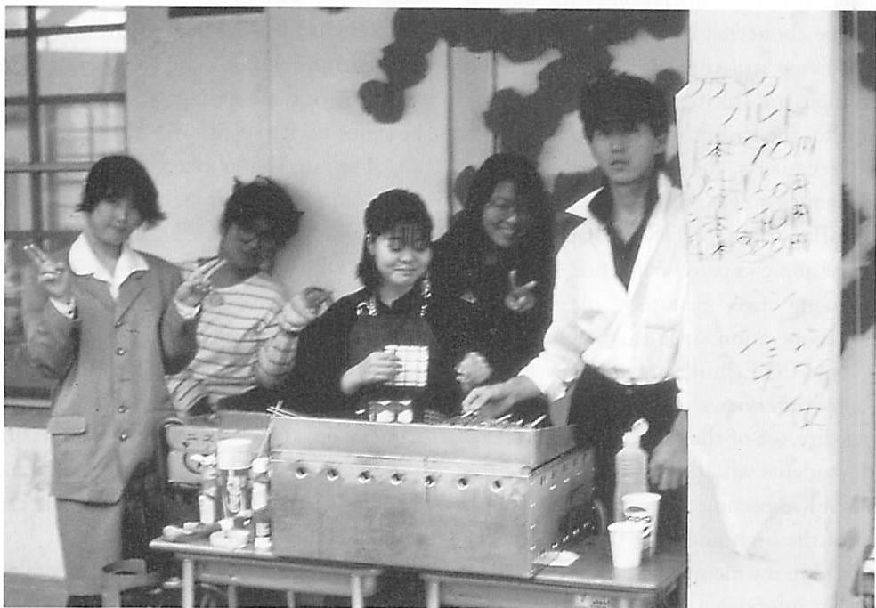 Selling hot food in one of the side streets of the school